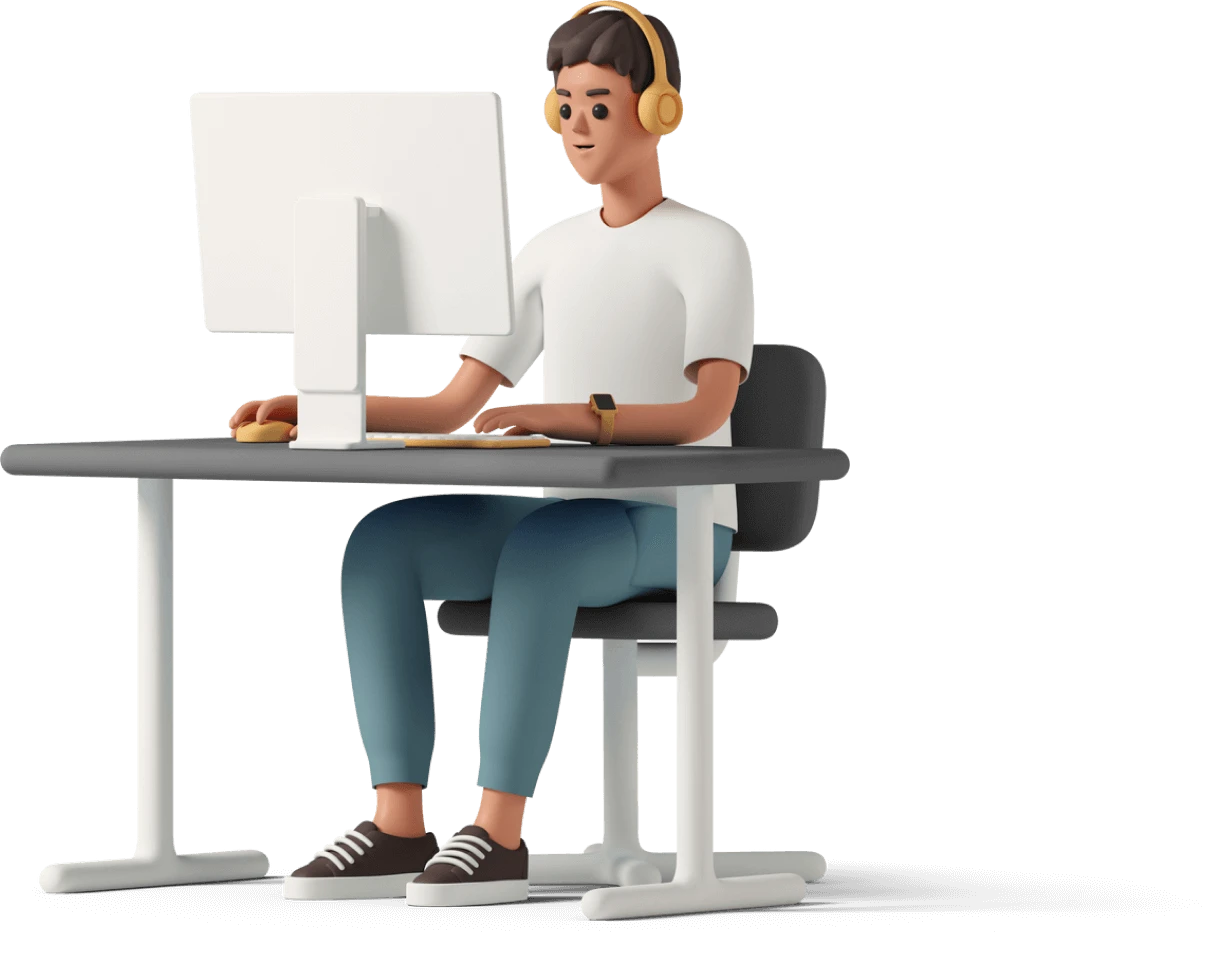 Boy sitting at desk using a computer